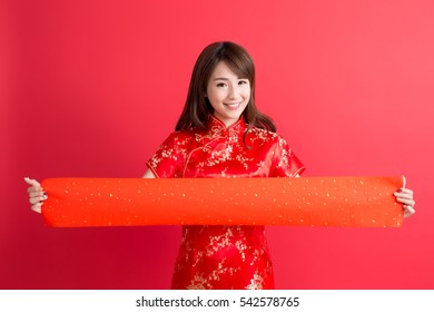 beauty woman wear cheongsam and show couplets with chinese new year