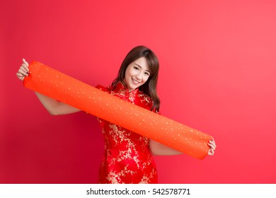 beauty woman wear cheongsam and show couplets with chinese new year