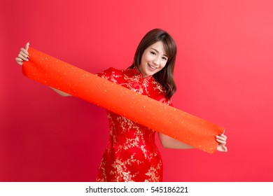 beauty woman wear cheongsam and show couplets with chinese new year