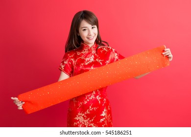 beauty woman wear cheongsam and show couplets with chinese new year
