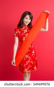 beauty woman wear cheongsam and show couplets with chinese new year