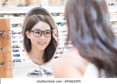 beauty woman wear eyeglasses in the store