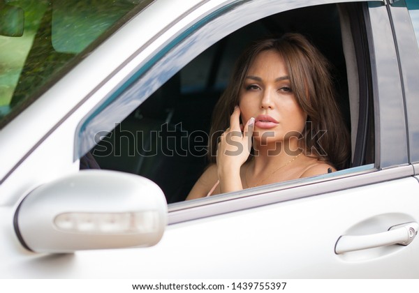 beauty young\
asian woman with car on a nature\
