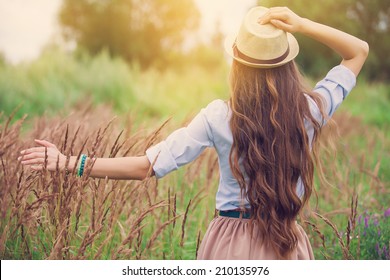 Beauty young girl outdoors enjoying nature