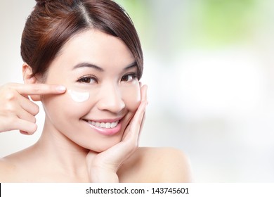 Beauty Young Woman Applying Cosmetic Cream Under Eyes, Concept For Eye And Skin Care,  Asian Beauty