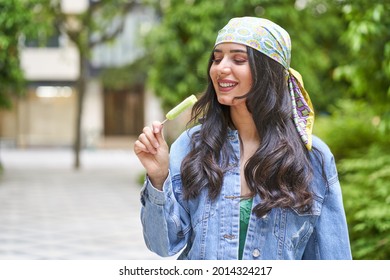 Beauty Young Woman Eating An Ice Lolly