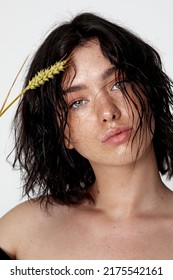 Beauty Young Woman Face With A Lot Of Freckles And Natural Lips, Wheat  Near Face, Close Up, Thicker Eyebrows