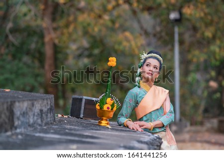 Beautyful Thai woman wearing thai traditional clothing

