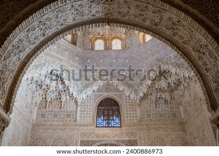  Beautyfull arch,capitals and stucco decoration portico in Mexuar Palace of the Lions, Alhambra, Andalusia, Spain. Magic breathtaking carved decoration  in orient style.