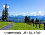 Beaver Creek village hiking trail in ski resort of Vail near Avon, Colorado in summer with spruce fir trees forest and green meadow