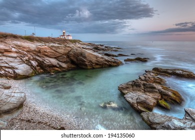 Beavertail Lighthouse Landscape At Night / This Is A Long Exposure HDR Photo Of Beavertail Lighthouse At Sunset Near Jamestown In Rhode Island, USA. This Is A Rocky Coastal Seascape.