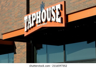Beaverton, OR, USA - Jan 25, 2022: Closeup of the TapHouse sign seen at the entrance to the TapHouse Bar and Grill, KingPins' full service lounge and sports bar in Beaverton, Oregon.