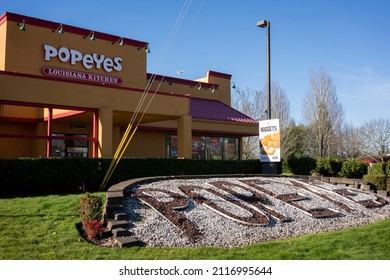 Beaverton, OR, USA - Jan 25, 2022: Exterior view of a Popeyes restaurant in Beaverton, Oregon. Popeyes Louisiana Kitchen, Inc., is a chain of fried chicken fast food restaurant headquartered in Miami.