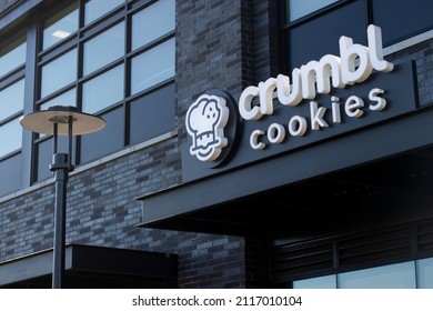 Beaverton, OR, USA - Jan 25, 2022: Closeup of the entrance sign of a Crumbl Cookies store in Beaverton, Oregon. Crumbl Cookies is a fast growing gourmet cookie company headquartered in Lindon, Utah.
