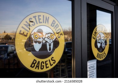 Beaverton, OR, USA - Jan 28, 2022: Closeup of the logo of Einstein Bros. Bagels seen at the entrance to one of its chain shops specializing in bagels and coffee, in Beaverton, Oregon.