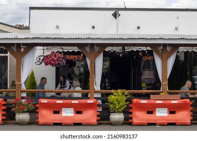 Beaverton, OR, USA - May 25, 2022: Outdoor dining at the Top Burmese Bistro Royale, a Burmese restaurant in Beaverton, Oregon.