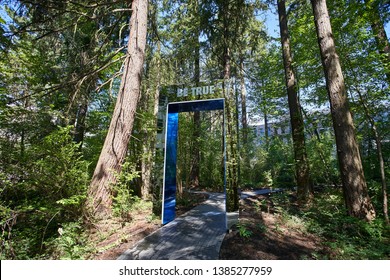 Beaverton, Oregon - Apr 30, 2019: "Be True" gate in a lush green wooded area at Nike World Headquarters.
