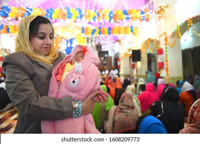 Beawar, Rajasthan, India - Jan. 2, 2020: A Young Woman With Her New Born Baby At A Holy Gurdwara On The Occasion Of The Birth Anniversary Of Guru Gobind Singh Ji In Beawar. Photo/Sumit Saraswat