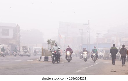 Beawar, Rajasthan, India, Jan. 3, 2021: Vehicles ply on a road amid dense fog during a cold winter morning in Beawar. Photo: Sumit Saraswat