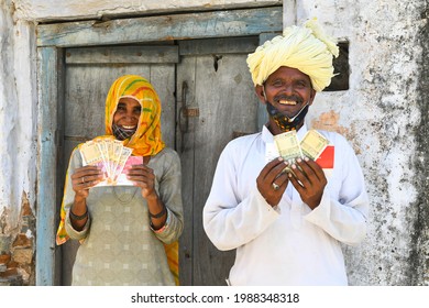 Beawar, Rajasthan, India, June 9, 2021: Beneficiaries Shows Money That They Received As COVID Relief From Rajasthan Government, Outside A Bank At Liri Village Near Beawar. Photo: Sumit Saraswat