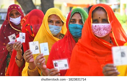 Beawar, Rajasthan, India, Sep 28,2020: Rajasthani Veiled Women Wait In Long Queues To Cast Votes At A Polling Station During Panchayati Raj Elections, Amid Coronavirus Pandemic, At Sendra Village.