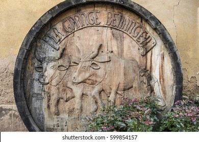 BEBLENHEIM, FRANCE - FEBRUARY 24, 2017: Carved End Of Wooden Wine Barrel Serving As Street Decoration In Rue Jean Mace. Featuring Oxen Ploughing A Field.