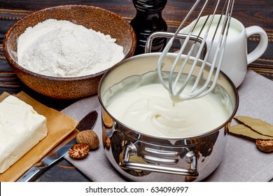 Bechamel Sauce In A Pan And Ingredients