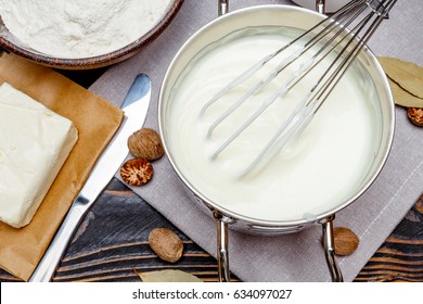 Bechamel Sauce In A Pan And Ingredients