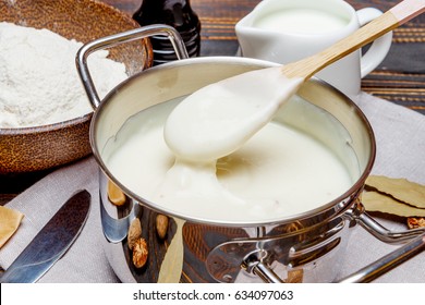 Bechamel Sauce In A Pan And Ingredients