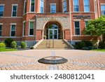 Becker Hall Entrance with Alumni Plaza on Bright Daytime View