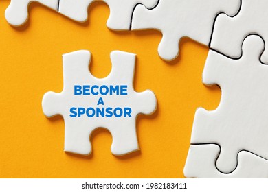 Become a sponsor message on a puzzle piece apart form the assembled pieces. Financial sponsorship support or charity donation concept.