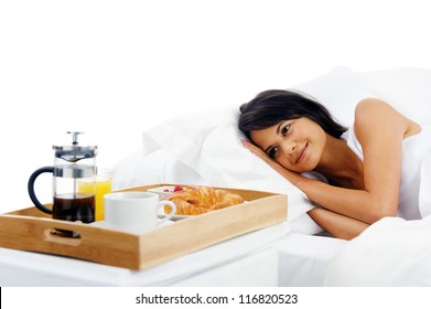 Bed And Breakfast For Attractive Young Woman Sleeping And Relaxing With Room Service Isolated On White Background