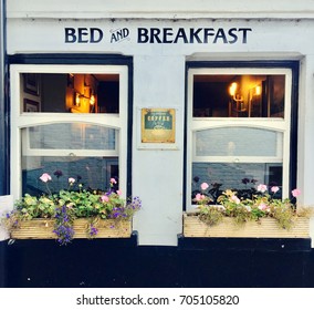 Bed and breakfast two windows with flower baskets wall