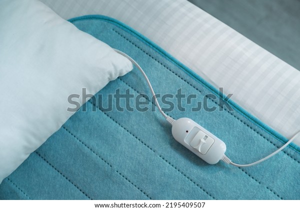 Bed with electric
heating pad, top view