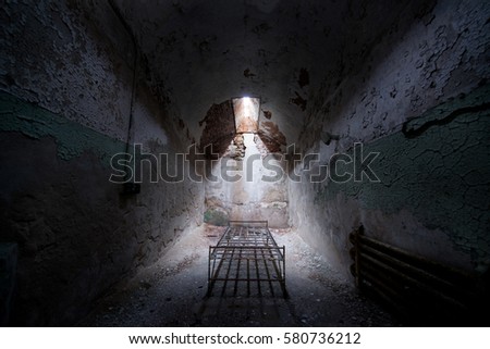 Bed frame in an abandoned cell 