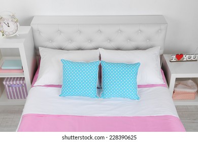 Bed In Pink Bed Linen In Room