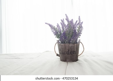 The Bed With Purple Lavender Flower And Sunlight From Glass Of Windows In Bedroom, High Key Picture Style.