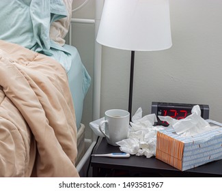 Bed Side Next To Tissues And Tea During Flu Season