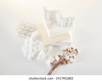 Bed Sponge And Spring With Cotton On The White Table Style.