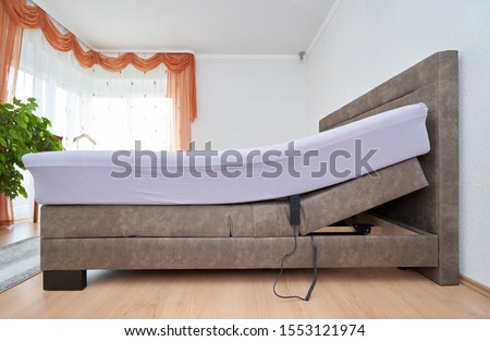 Bed with tilt adjustment mattress bed in the bedroom of the house, comfortable mattress and sleep