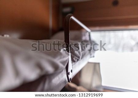 Bed in a train in a compartment .