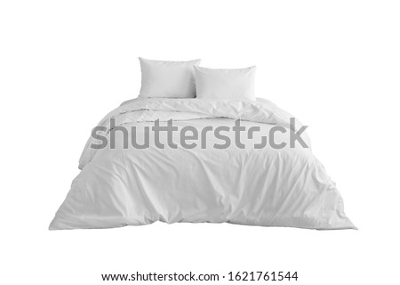 Bed with two pillows and white bed linen Isolated. Bedding against white background.