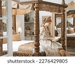 Bedchamber solitude. an elegant noble woman reading in her palace room.