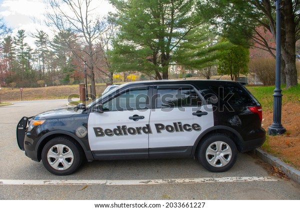 BEDFORD, MA, USA - APR. 13, 2021: Ford Police\
Interceptor Utility SUV car in Middlesex Community College in town\
of Bedford, Massachusetts MA, USA.\
