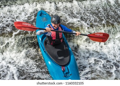 Bedford,Bedfordshire,UK,August 19, 2018. White water kayaking in the UK, quick reactions and strong boat control skills.