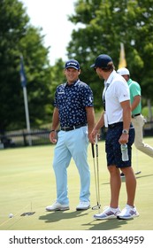 BEDMINSTER,NJ-JULY 31,2022: Patrick Reed (L) On The Practice Green During  The LIV Golf Tournament Held At The Trump National Golf Club In Bedminster,NJ.