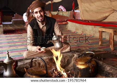 Bedouin man serving Arabic coffee in Wadi Rum,Jordan