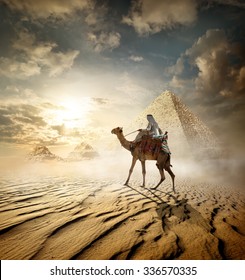 Bedouin On Camel Near Pyramids In Fog