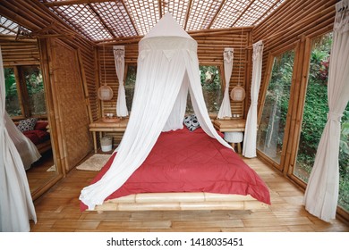 Bedroom in bamboo  wooden  bungalow.Interior wooden tropical beach bungalow with natural roof and wall
