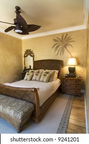 Bedroom Decorated In Tropical Style With Ceiling Fan